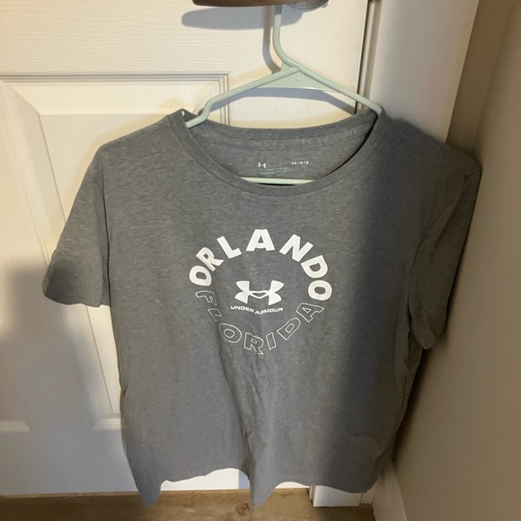 Under Armour Tops - Orlando Florida under armour shirt size large like new condition